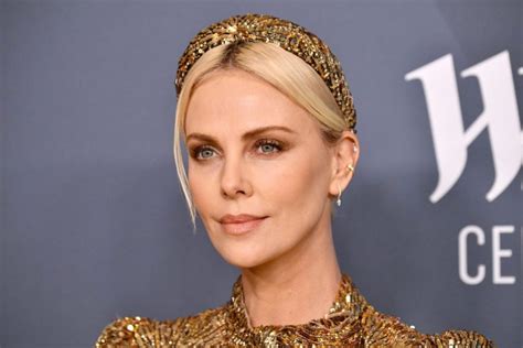 Such An Unusual Outfit Charlize Theron In A Dress With Cutouts Under