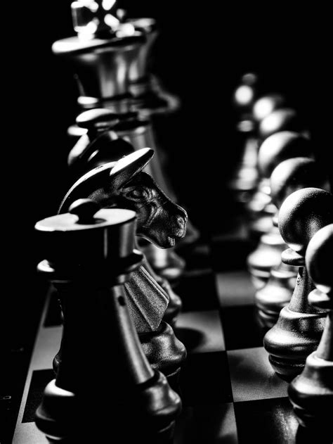 Grayscale Photo Of Chess Pieces On A Chessboard · Free Stock Photo