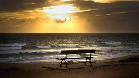 Seashore With Waves And Bench Under Cloudy Sky And Sunset Hd Sunset