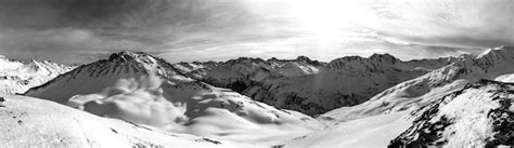 Premium Photo Panoramic Grayscale Of Rocky Mountains Covered By Snow