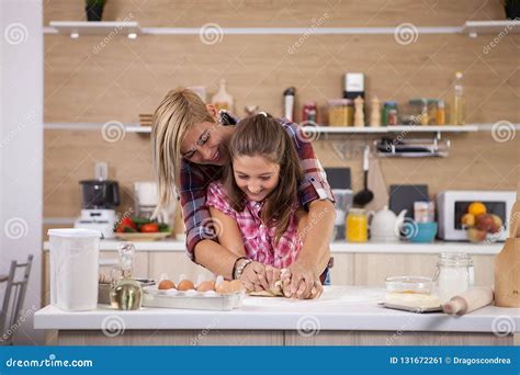 Portrait Of Excited Mom And Daughter Having Fun While Cooking Stock