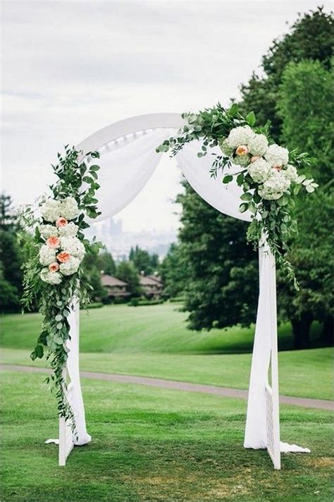 White And Green Wedding Alter With A Touch Of Peach White Wedding Arch