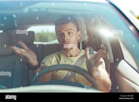 Angry Emotional Man Driving His Car Without Knowing The Road Stock