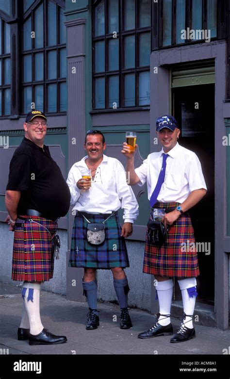 Scotland Glasgow Three Scottish Men Standing Outside A Pub Wearing