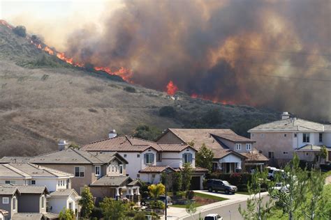 Southern California brush fire near houses | Construction Bonds, Inc.