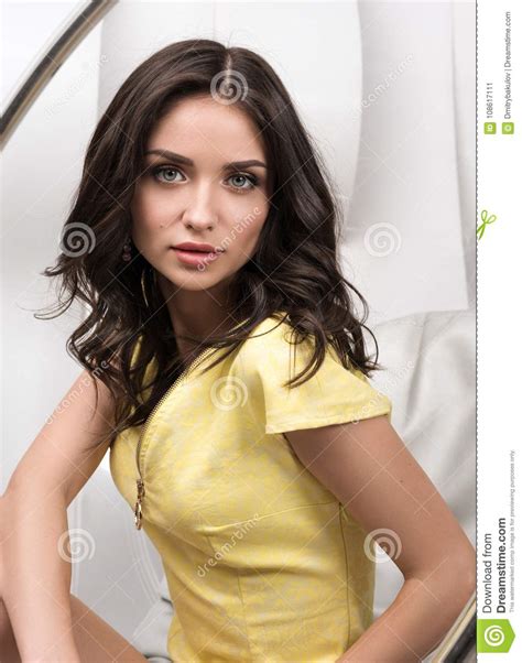 Vertical Portrait Of Young Beautiful Woman In Yellow Dress Stock Image