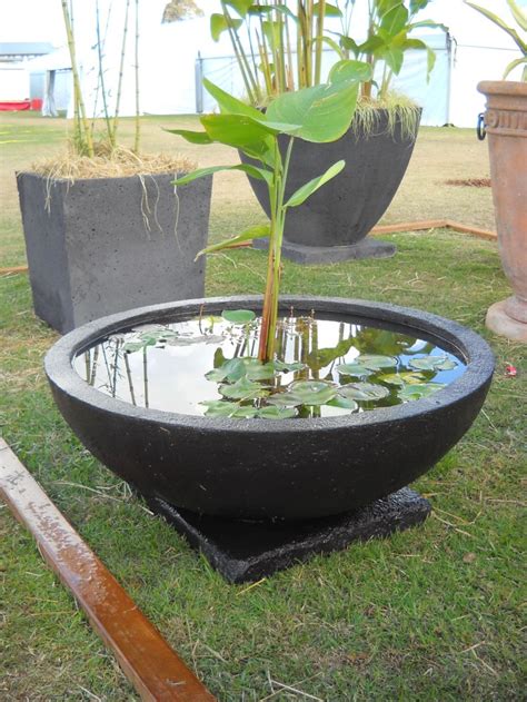 Simply fill the basin with water and the hidden pump will recycle it continually. Potanico Contemporary Garden Water Features and Wall Plaques