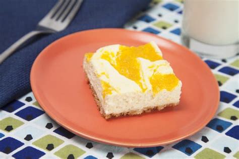 Peaches And Cream Cheesecake Bars Featuring Canned Peaches And Sweetened