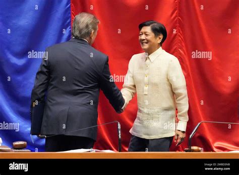 President Elect Ferdinand Bongbong Marcos Jr Right Shakes Hands