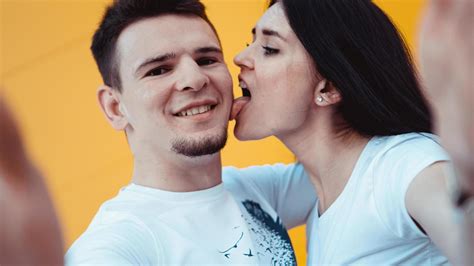 Handsome Man With Beautiful Sexy Woman Licking Man Cheek Stock Photo At Vecteezy