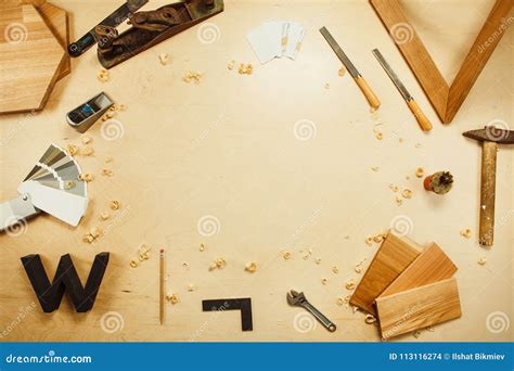 Carpentry Work Tools On Background With Wooden Cuttings Stock Photo