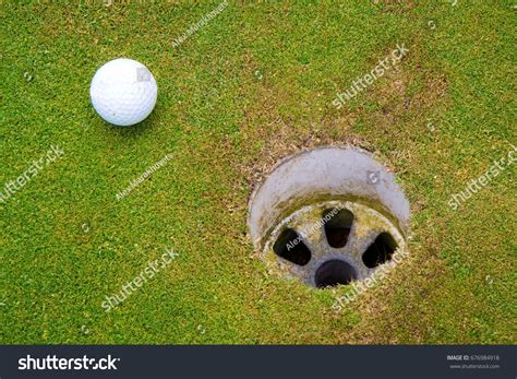Golf Ball On Edge Hole Stock Photo 676984918 Shutterstock