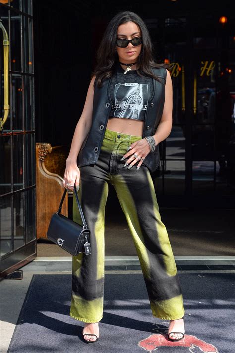 Charli Xcx Dons Green Denim With A Crop Top As She Steps Out In New