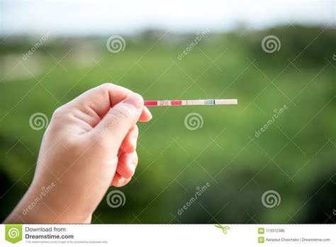 Testing blood for hcg results in the earliest detection of pregnancy. Positive Pregnancy Test On Strip. Stock Photo - Image of ...