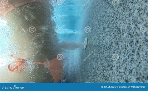woman in bikini underwater massage with jets in hot tub spa with bubbles female relax in the