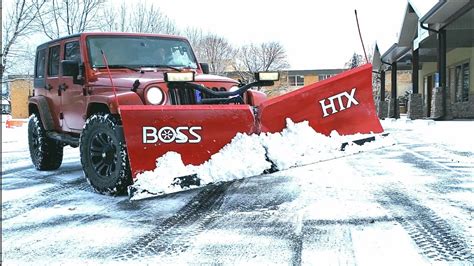 Snow Removal Of Parking Lot With Jeep Wrangler And Boss Htx V Plow