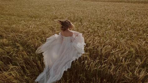 Woman Running Through Wheat Field In Flowing Stock Footage Sbv