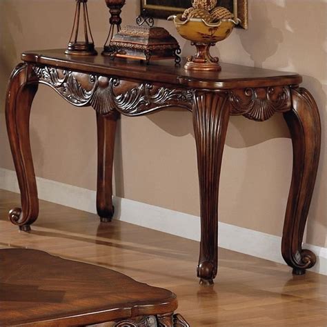 Place a console table behind your sofa for extra surface area. Coaster Venice Traditional Sofa Table in Deep Brown Medium Wood Finish - 700469