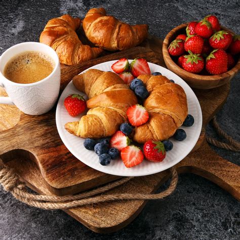 Delicious Croissant Breakfast With Fresh Berries And Coffee
