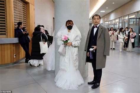 Thousands Of Couples Marry At Mass Church While Covering Faces During