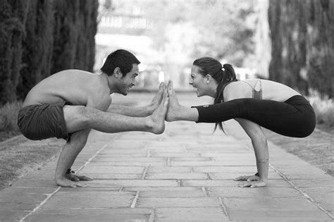 dice iida klein and ashley albrand in tittibasana partner yoga poses acro yoga poses partner