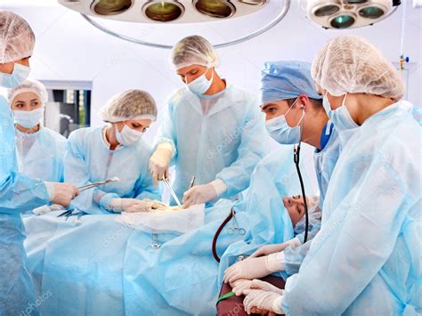 Surgeon At Work In Operating Room — Stock Photo © Poznyakov 11295052