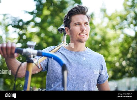 Man Carrying On Bike Hi Res Stock Photography And Images Alamy