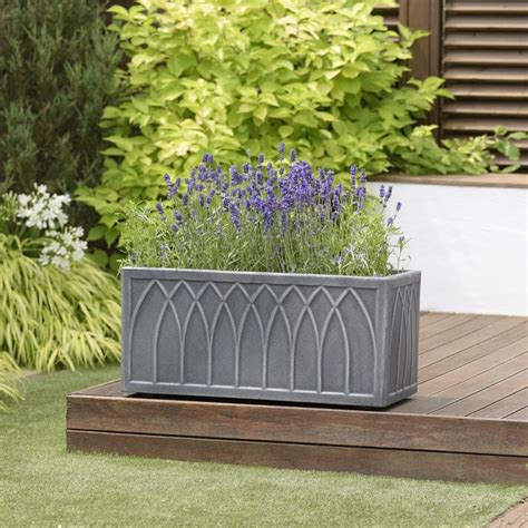 The versailles is a planter which is designed after the french orange box tree planters which have been a recognizable style throughout the years. Versailles Trough, 70cm - Dobbies Garden Centres | Trough planters, Decorative planters, Planters