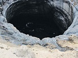 Two more giant holes discovered after crater 'at the end of the world ...