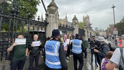 anti monarchy protesters hold blank signs outside parliament the big issue