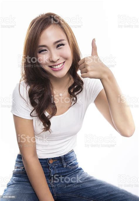 Happy Smiling Girl With Thumbs Up Gesture Isolated On White Stock Photo