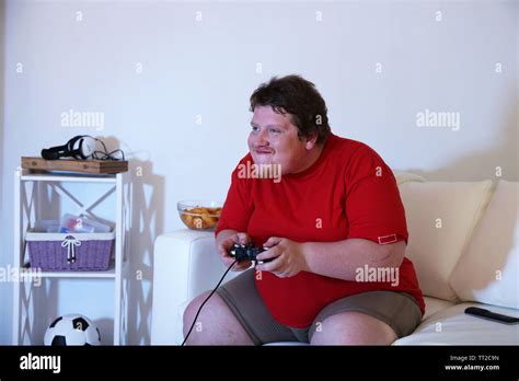 Fat Man Playing Video Games On Home Interior Background Stock Photo Alamy