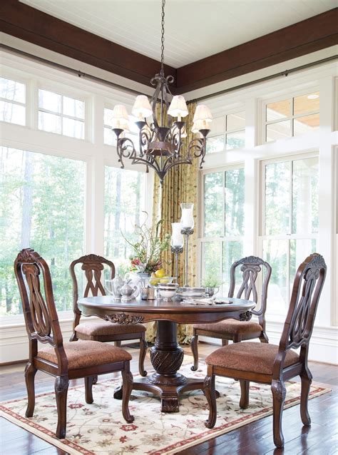 That is why we offer such a large variety of discount dining room sets as well as individual dining furniture pieces. North Shore Round Pedestal Dining Room Set from Ashley ...