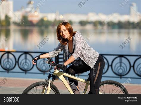 Young Redhead Woman Riding Bike On Image And Photo Bigstock