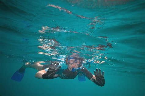 A Woman In Swimsuit Snorkeling At Maldives Island Stock Image Image