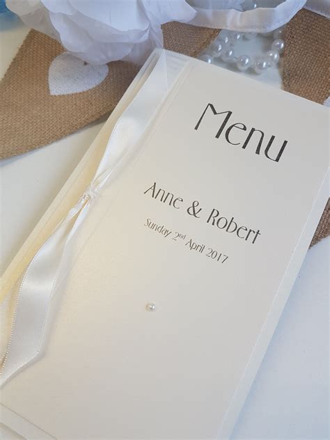 Traditional Ivory Pearlised Wedding Breakfast Menu With Knotted Ribbon