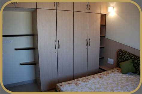 Some of the baby wooden almirah designs feature a lock and drawers. Room almirah photos