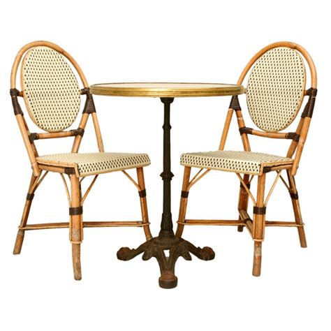The chair that was once relegated to the cobblestone sidewalks of paris has now arrived inside many. c.1950 French Bistro Table Paired w/ Bamboo Chairs at 1stdibs
