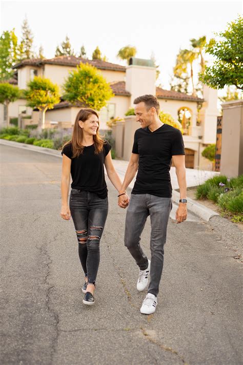 Man And Woman Holding Hands While Walking On The Street · Free Stock Photo