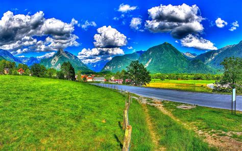 Blue Sky And White Clouds High Mountains With Pine Forest Meadow With