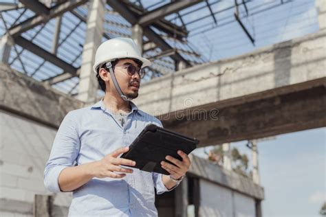 Portrait Civil Engineer Serious Working Inspection In Construction
