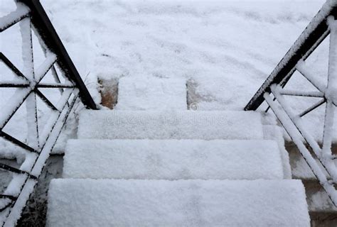 Stairway To Snowy Ground Steps Covered In Snow In Winter Stock Photo