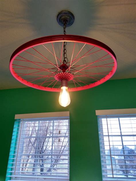 For safety and for the beauty of it, these diy bike lights help you see and be seen. Bike rim light #repurposed this #bike rim to make #update an old light fixure. #diy | Bicycle ...