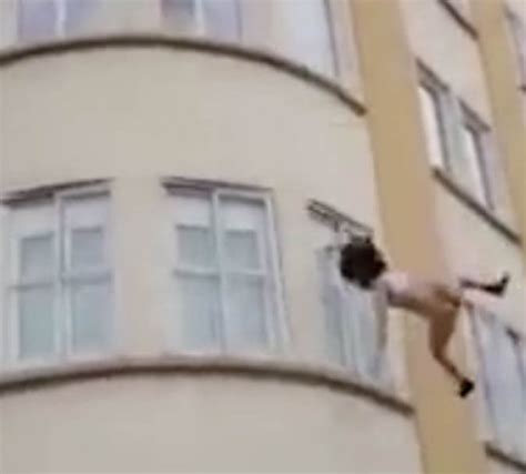 Video Woman In Underwear Survives Three Storey Jump From Burning