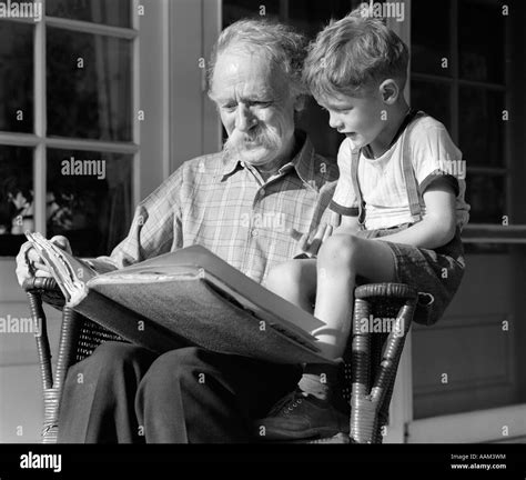 Grandfather Reading With Grandson Black And White Stock Photos And Images