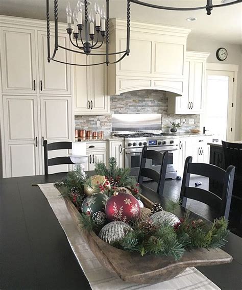 The names of ornaments to decorate trees include tinsel, baubles, candy canes, bows, pictures, picture frames, sometimes a star or angel on the top, ribbon, greeting. Antique dough bowl centerpiece with Christmas ornaments | Christmas kitchen decor, Christmas ...