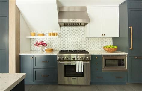 Kitchen dark lower cabinets white upper. White and blue kitchen boasts white upper cabinets and ...