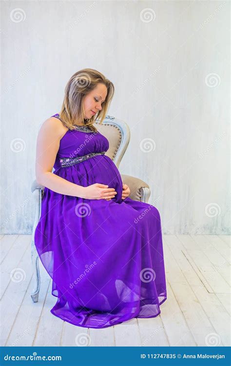 Pregnant Woman In Violet Dress Sitting On Chair Stock Image Image Of
