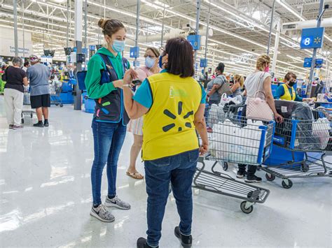 Download Walmart shoppers searching for their favorite items at a