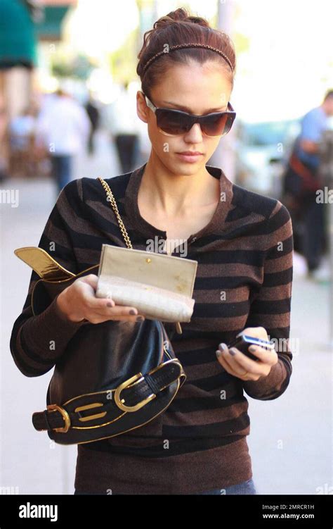 Actress Jessica Alba Checks Messages On Her Cellphone While Strolling In Beverly Hills Ca 10